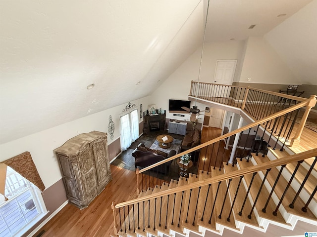 bonus room with hardwood / wood-style floors and lofted ceiling