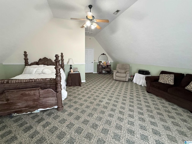 bedroom featuring lofted ceiling, dark colored carpet, and ceiling fan