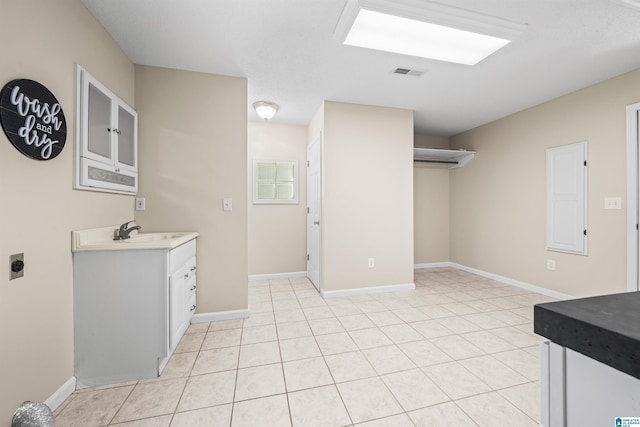 interior space with sink and tile patterned floors