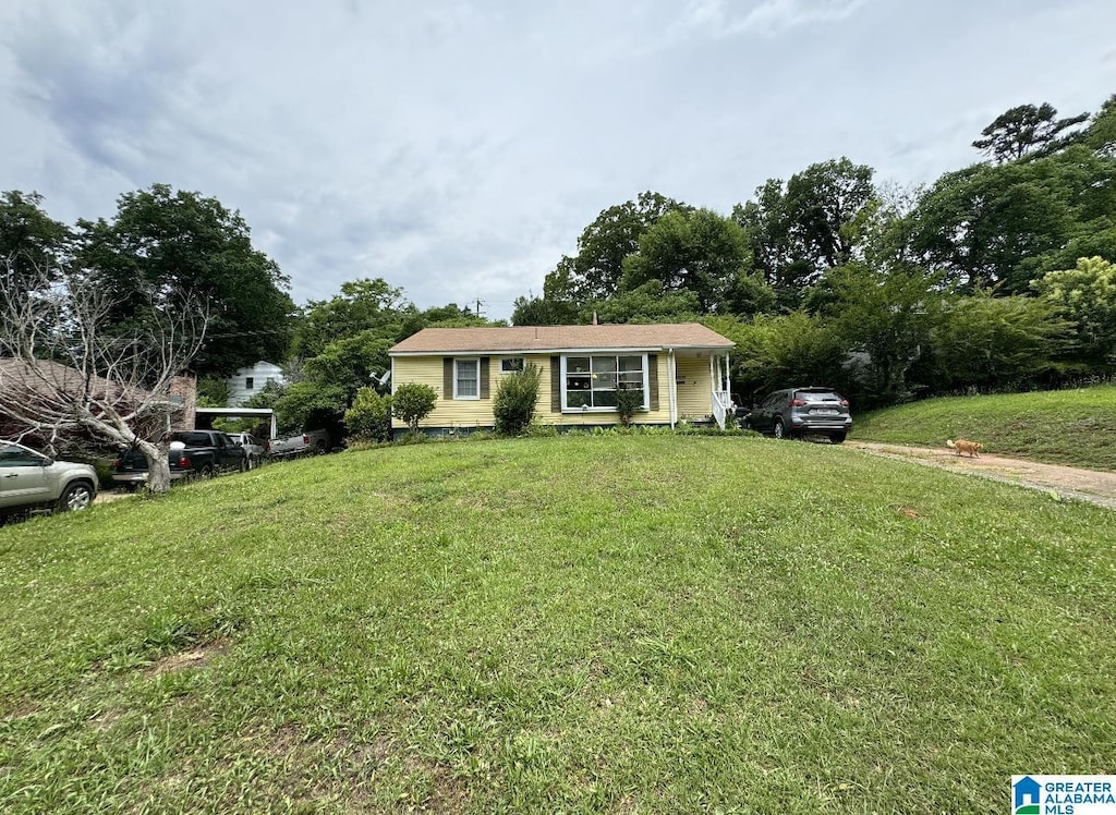 view of front of home with a front yard