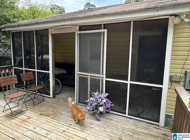 deck with a sunroom