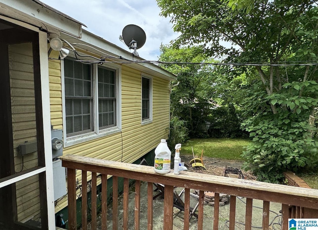 view of property exterior with a deck