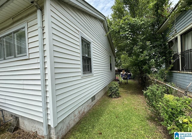 view of home's exterior featuring a yard