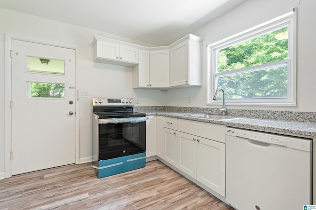 kitchen featuring white cabinetry, sink, white dishwasher, and stainless steel range with electric stovetop