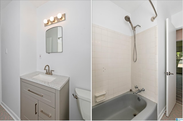 full bathroom featuring vanity, tiled shower / bath combo, and toilet