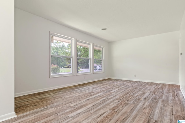 spare room featuring light hardwood / wood-style floors