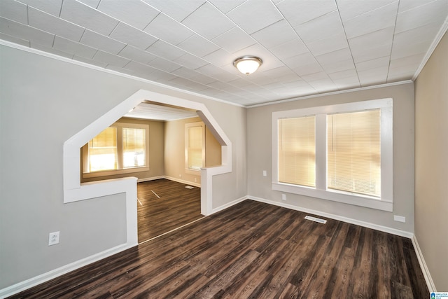 additional living space with dark hardwood / wood-style flooring