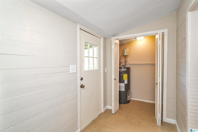 hallway featuring electric water heater and vaulted ceiling