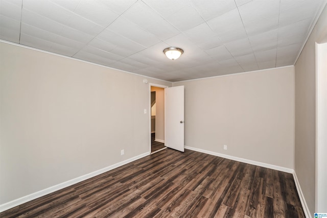 unfurnished room featuring dark hardwood / wood-style flooring