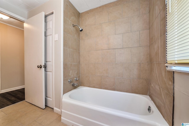 bathroom featuring tiled shower / bath combo and tile patterned floors