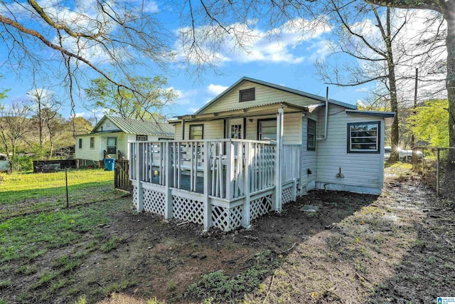 back of property featuring a deck