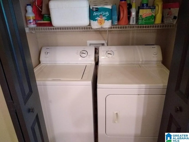 laundry room with washer and dryer and laundry area