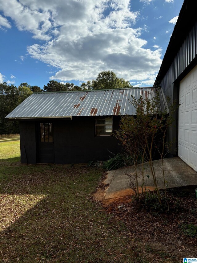 view of property exterior featuring a garage