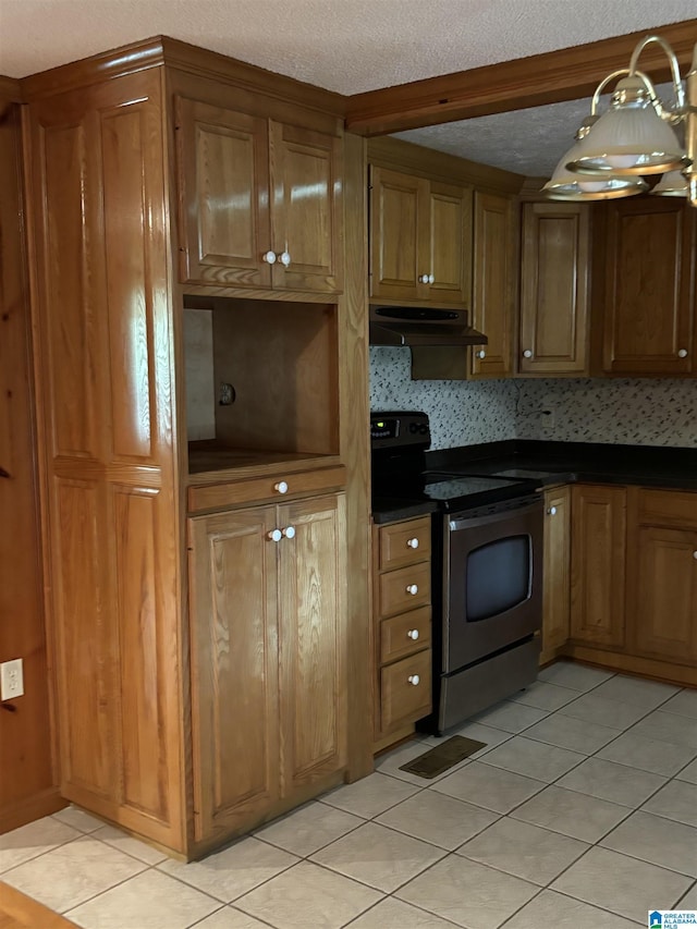 kitchen featuring a textured ceiling, light tile patterned flooring, and stainless steel range with electric stovetop