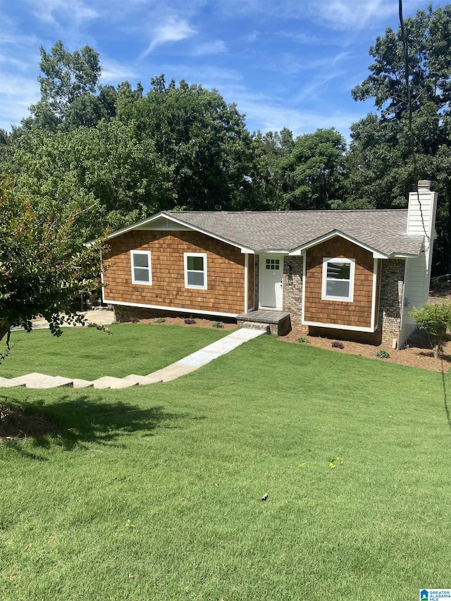 ranch-style home featuring a front yard