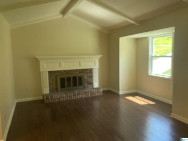 unfurnished living room featuring dark hardwood / wood-style floors, a fireplace, and lofted ceiling with beams