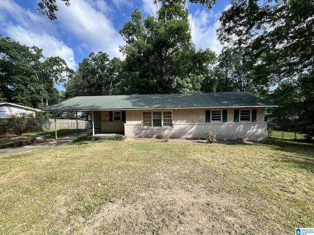 ranch-style home with a front lawn and a carport