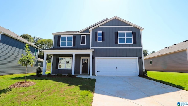 view of front of property with a garage and a front lawn