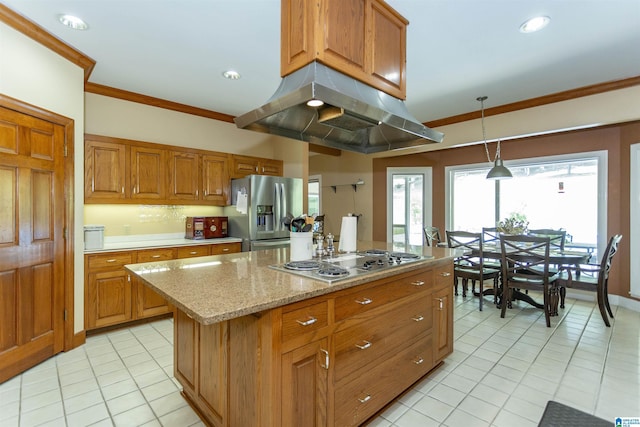 kitchen with appliances with stainless steel finishes, ornamental molding, pendant lighting, a kitchen island, and range hood