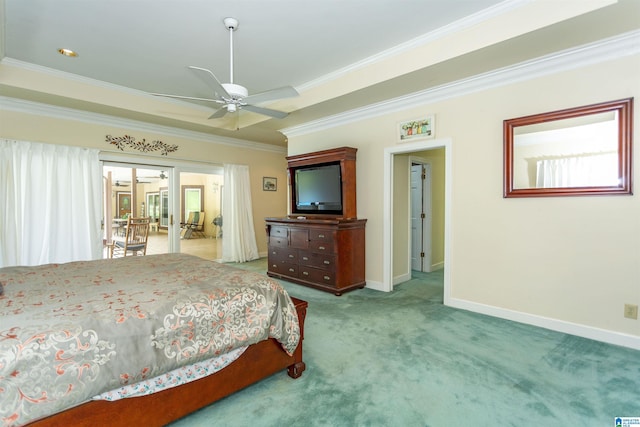 carpeted bedroom featuring ceiling fan and crown molding