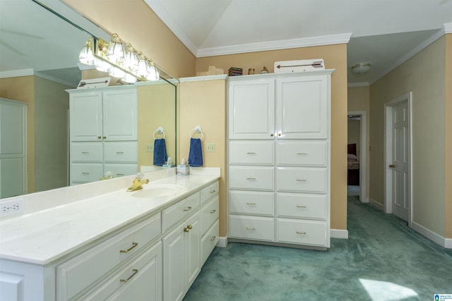 bathroom featuring vanity, lofted ceiling, and ornamental molding