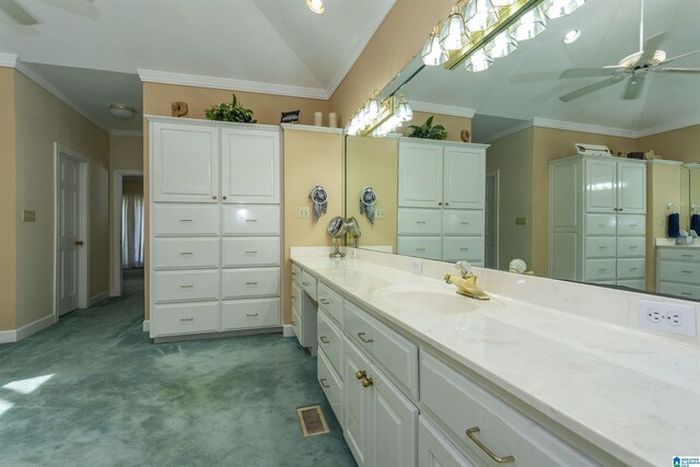 bathroom with vanity, crown molding, ceiling fan, and lofted ceiling