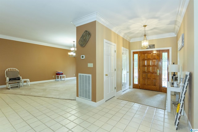 carpeted foyer entrance with a notable chandelier and ornamental molding