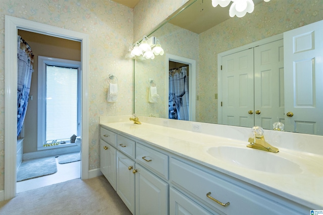 bathroom with a shower with curtain and vanity