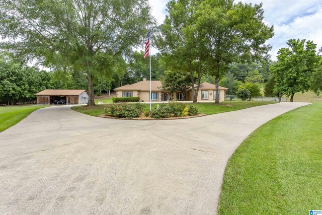 ranch-style home with a front lawn