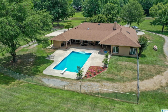 view of pool featuring a diving board, a yard, and a patio