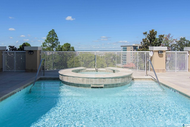 pool with an in ground hot tub
