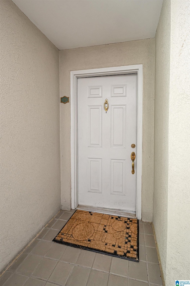 doorway to property with stucco siding