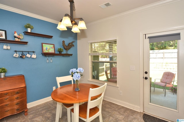 dining area with an inviting chandelier and ornamental molding