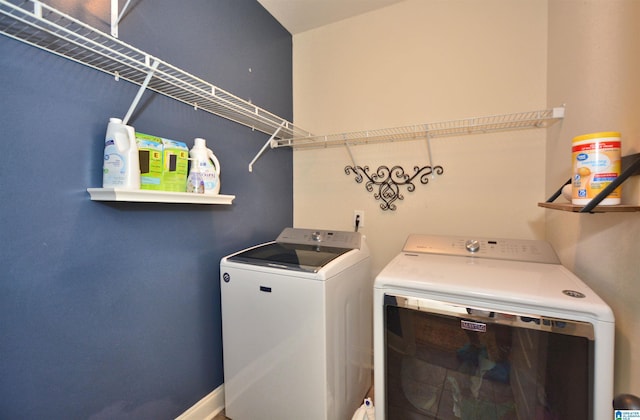 laundry area with washing machine and clothes dryer