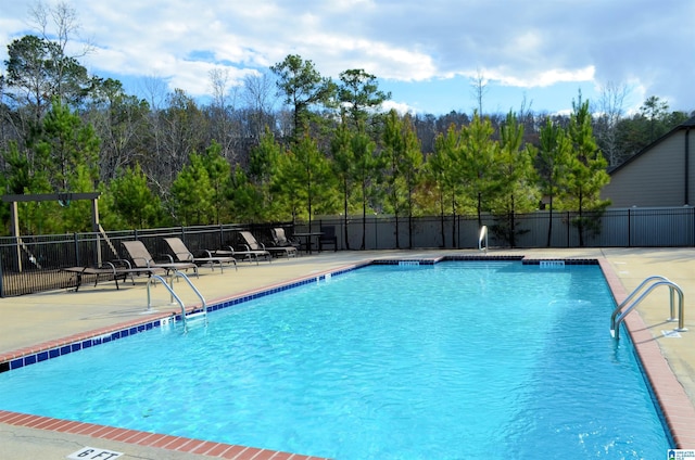 view of pool featuring a patio