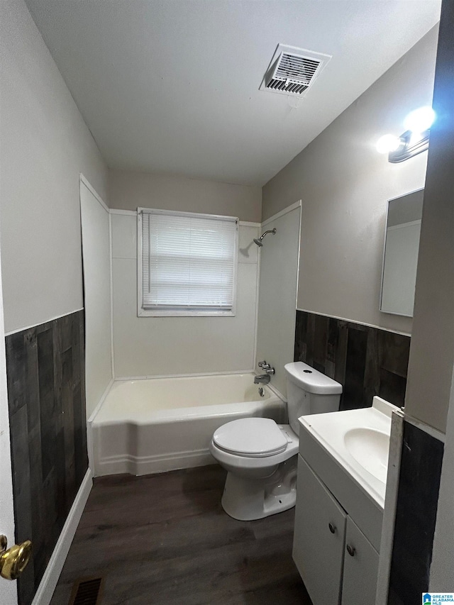 full bathroom with vanity, hardwood / wood-style flooring, shower / bathing tub combination, and toilet