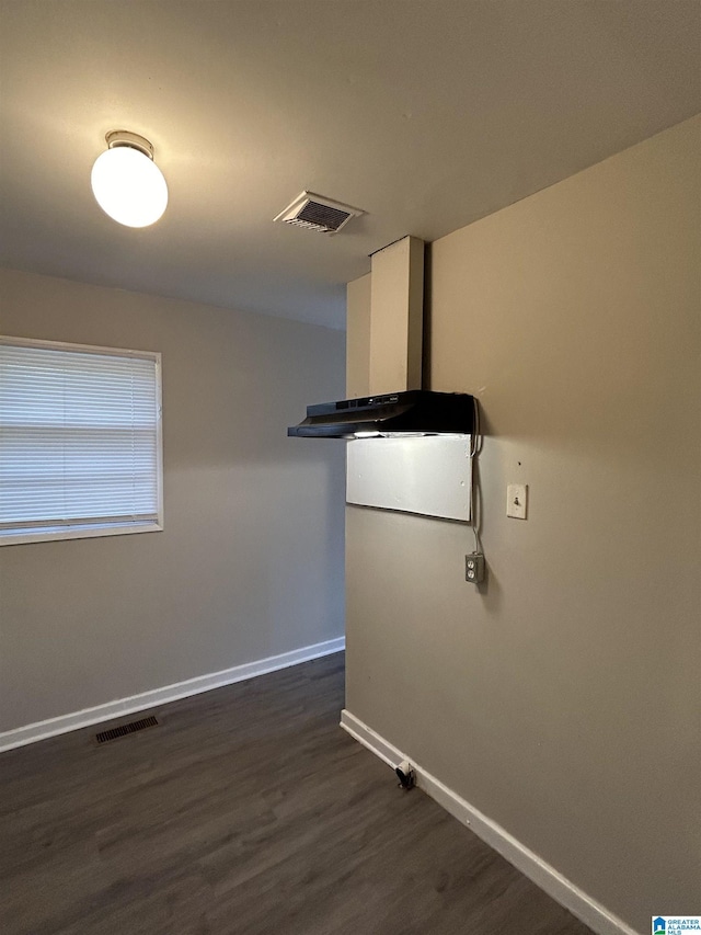 1616 Hatchet Ave, Tarrant, AL 35217 - spare room featuring visible vents, baseboards, and dark wood-style flooring