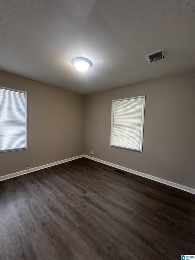 room details featuring wood-type flooring and wall chimney range hood