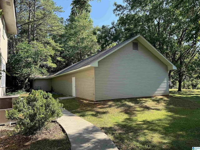 view of side of property with a yard