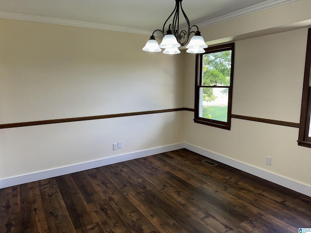 unfurnished room featuring crown molding, dark hardwood / wood-style floors, and a notable chandelier