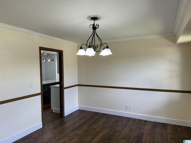 unfurnished room featuring dark hardwood / wood-style flooring, crown molding, and a notable chandelier