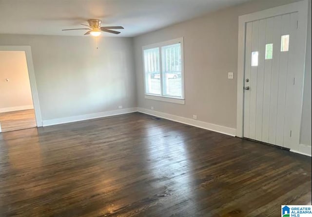 entryway with dark wood-type flooring and ceiling fan