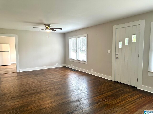 kitchen with sink, light hardwood / wood-style flooring, light stone counters, and white cabinetry