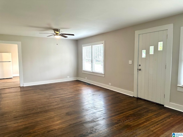 foyer entrance with dark hardwood / wood-style flooring and ceiling fan