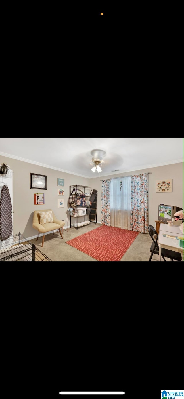 interior space featuring crown molding and ceiling fan