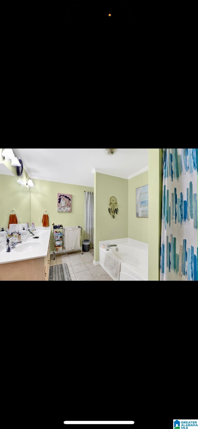 bathroom featuring vanity, tile floors, and a bathtub