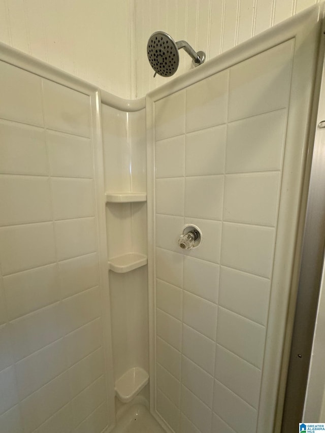 bathroom with tiled shower