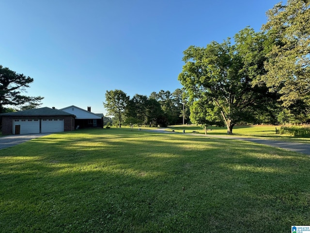 view of yard featuring a garage