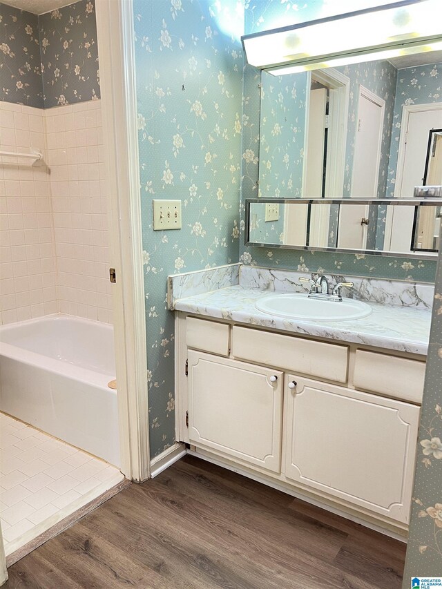 carpeted bedroom with ceiling fan and a closet