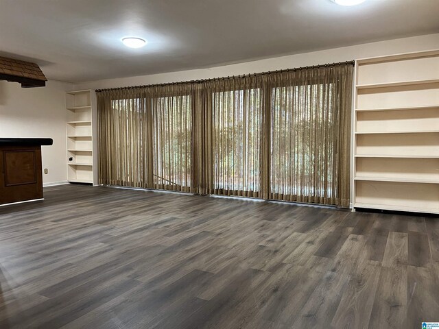 1047 Ivy Hills Cir Unit 1047, Hoover, AL 35216 - unfurnished living room with wood finished floors and baseboards